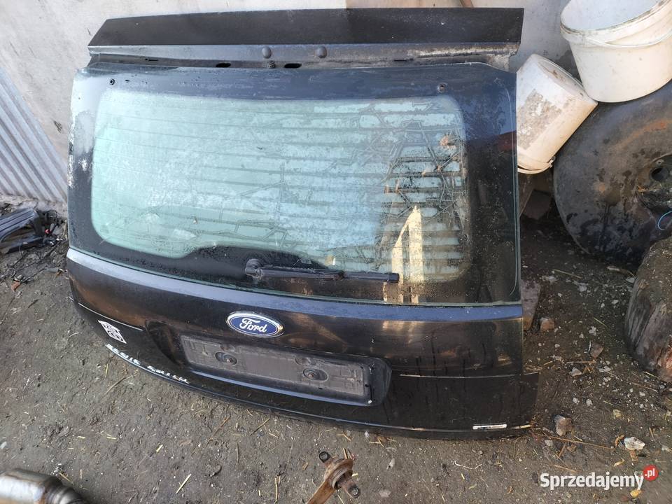 FORD FOCUS C MK1 SZYBA KLAPA BAGAŻNIKA NAPIS Kamień-Kolonia