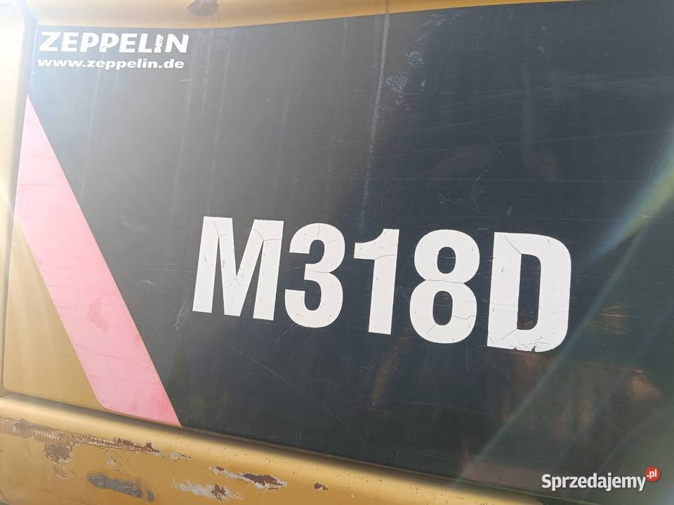 CAT M318D kołowa koparka produkcji 2009 Nisko