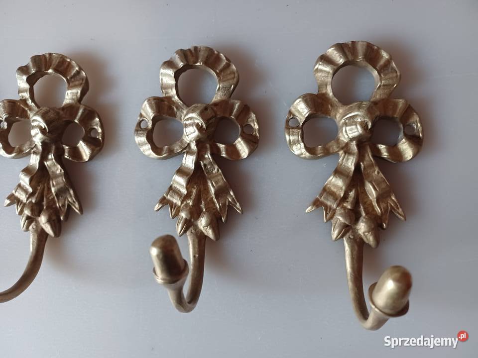 Komplet czterech pięknych mosiężnych wieszaków Poznań