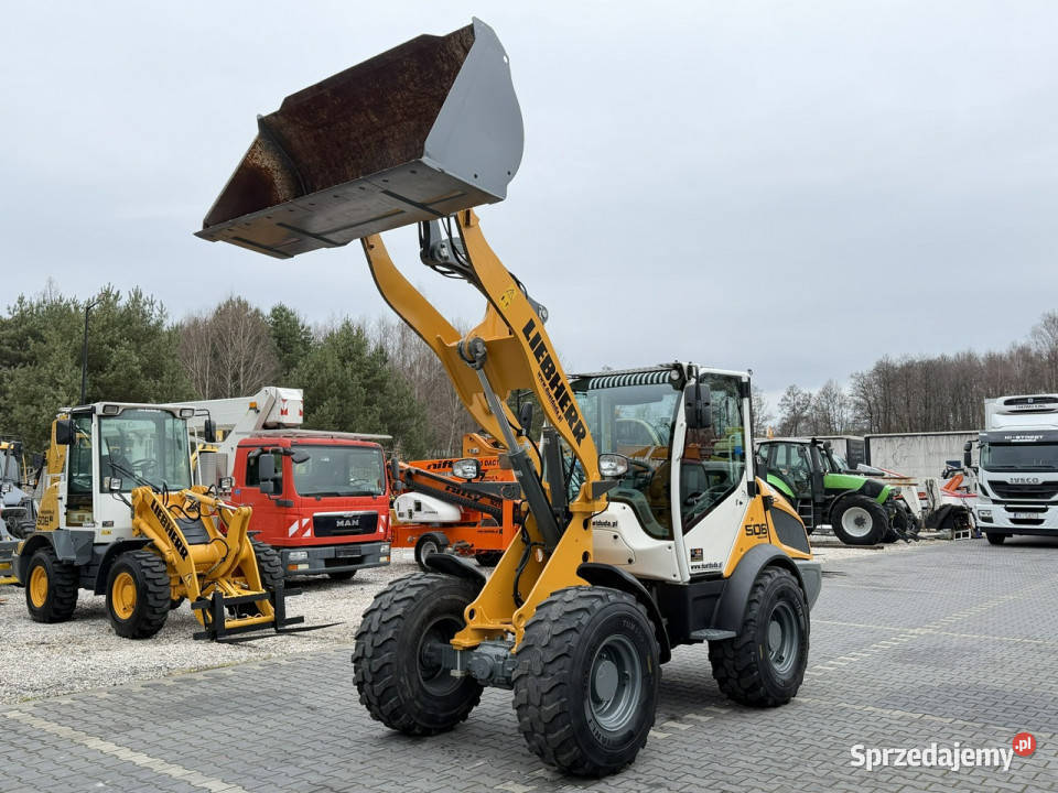 średnia kołowa Liebherr L 506 Compact Łyżka Koparko ładowarki Widełki