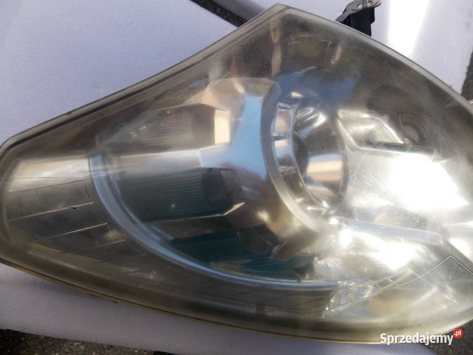 Reflektor przedni Koleos I xenon lewy 26060 JY Łosice