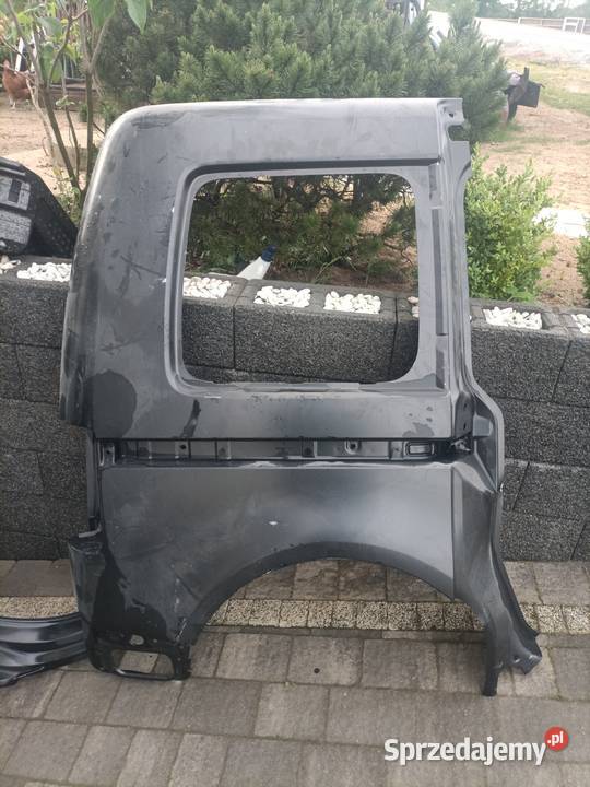 Błotnuk tył prawy VW Caddy oryginalny Luzino