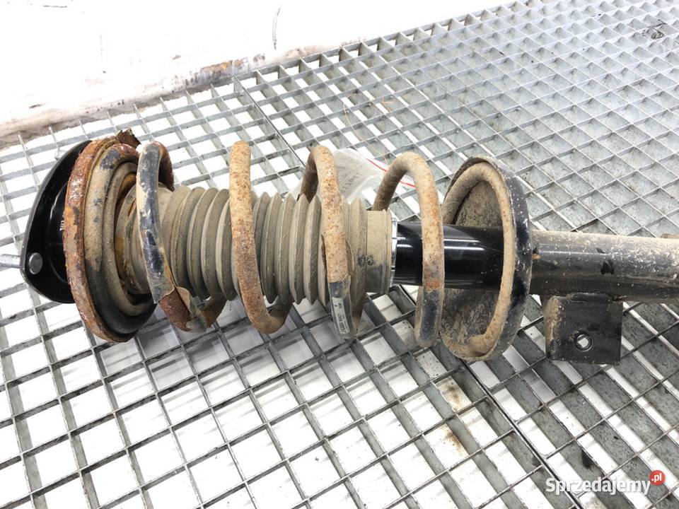AMORTYZATOR LEWY PRZÓD ZE SPRĘŻYNĄ SUZUKI GRAND