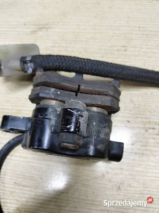 Zacisk hamulca tył pompa zbiorniczek wyrównawczy Łubno