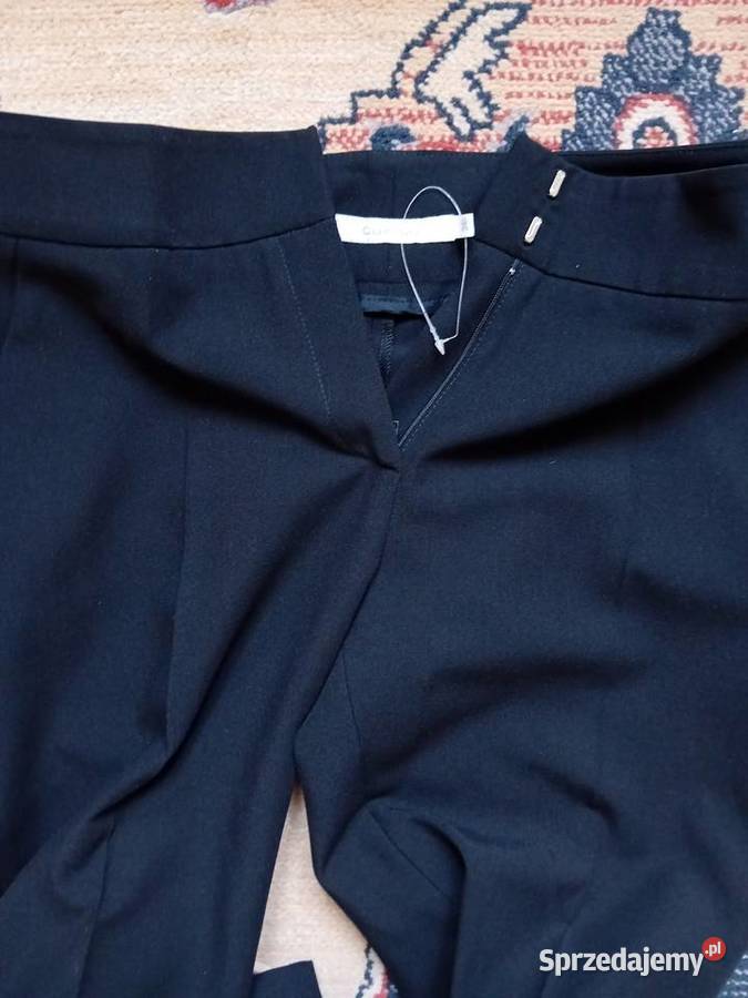 nieużywane eleganckie firmowe spodnie damskie