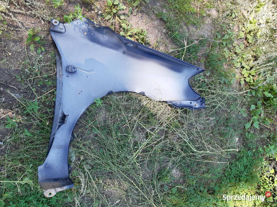 Corolla E12 Blotnik lewy przod oryginal mazowieckie