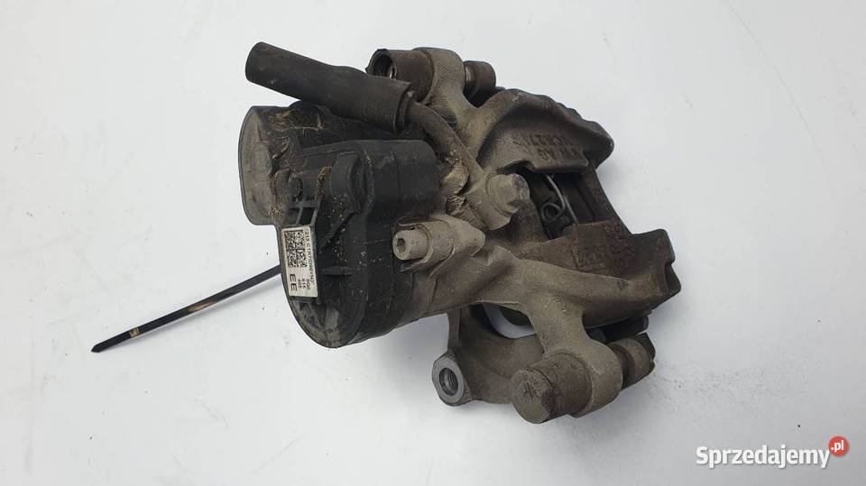 ZACISK HAMULCOWY TYŁ LEWY 5Q0615405EE GOLF VII Lipno