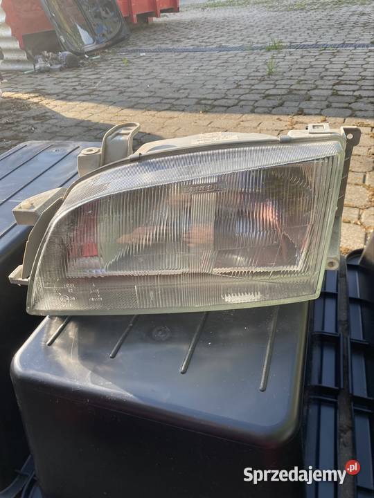 NOWY Reflektor Lewy Przód Toyota Carina E T19 osobowe łódzkie Kamocin