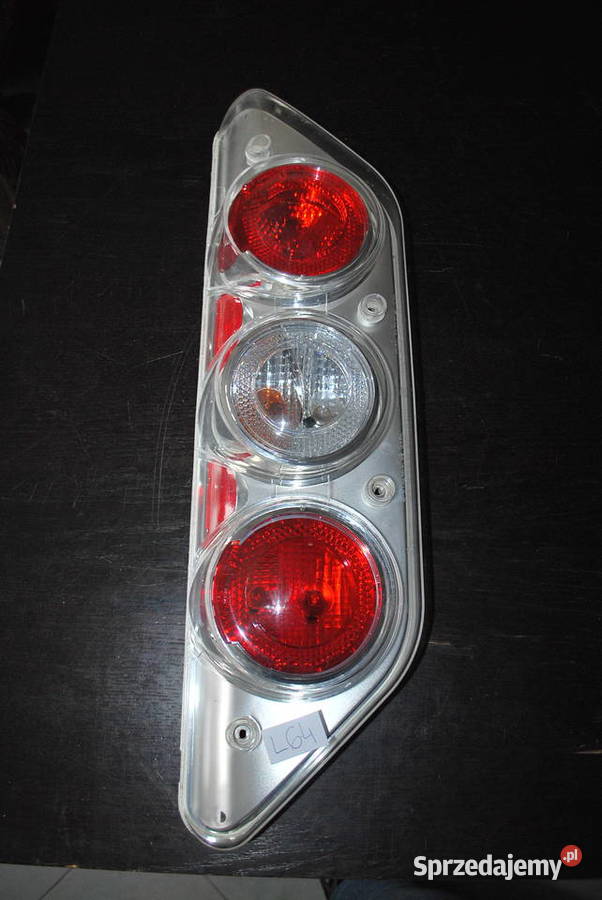 USZKODZONA LAMPA HELLA CARALUNA Grzebowilk