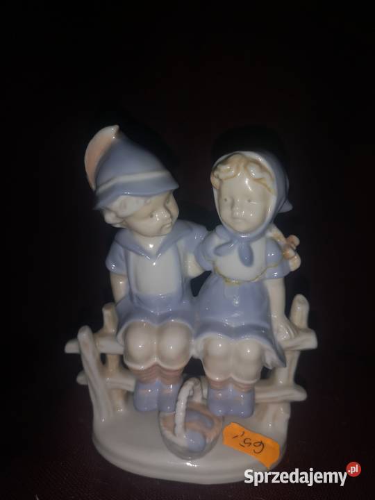 Figurka dzieci na płocie