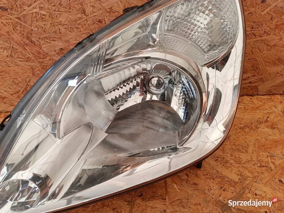 LAMPA LEWY PRZÓD REFLEKTOR EU 33150SCAYG021M1 osobowe Nowy Tomyśl