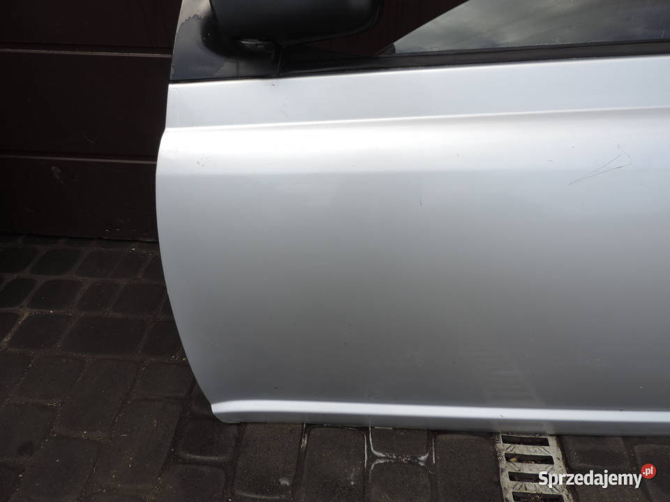 DRZWI LEWY PRZÓD TOYOTA YARIS I HB FL 1E7 osobowe Nowy Sącz