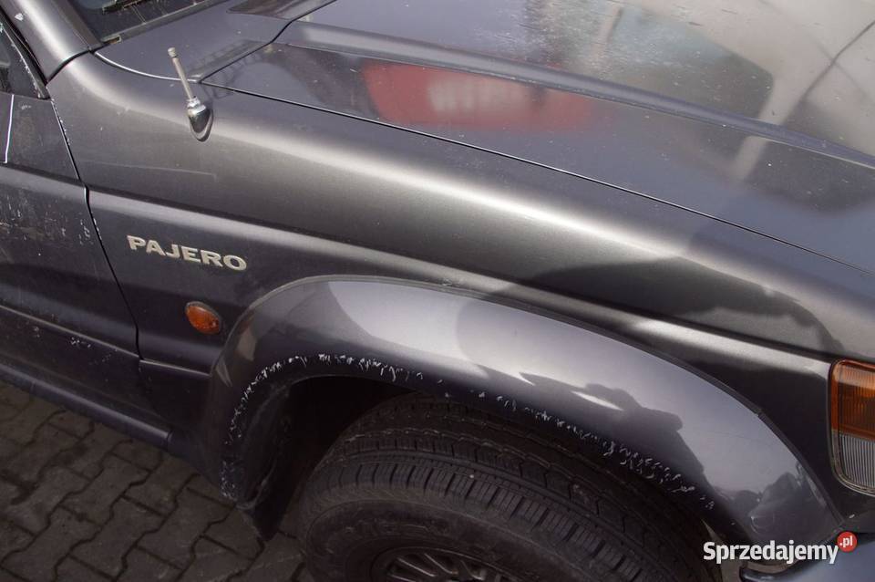 BŁOTNIK PRAWY PRZÓD MITSHUBISHI PAJERO osobowe Pozostałe Lipno