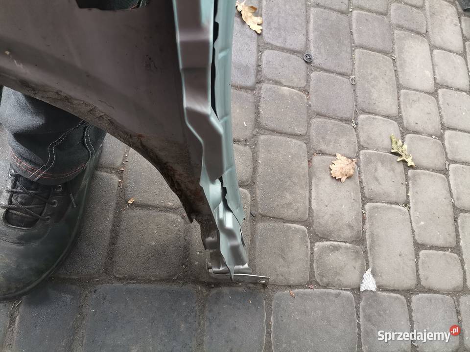 NISSAN PRIMERA P12 BŁOTNIK PRAWY PRZEDNI KY0G Rok produkcji 2005 Nowy Sącz