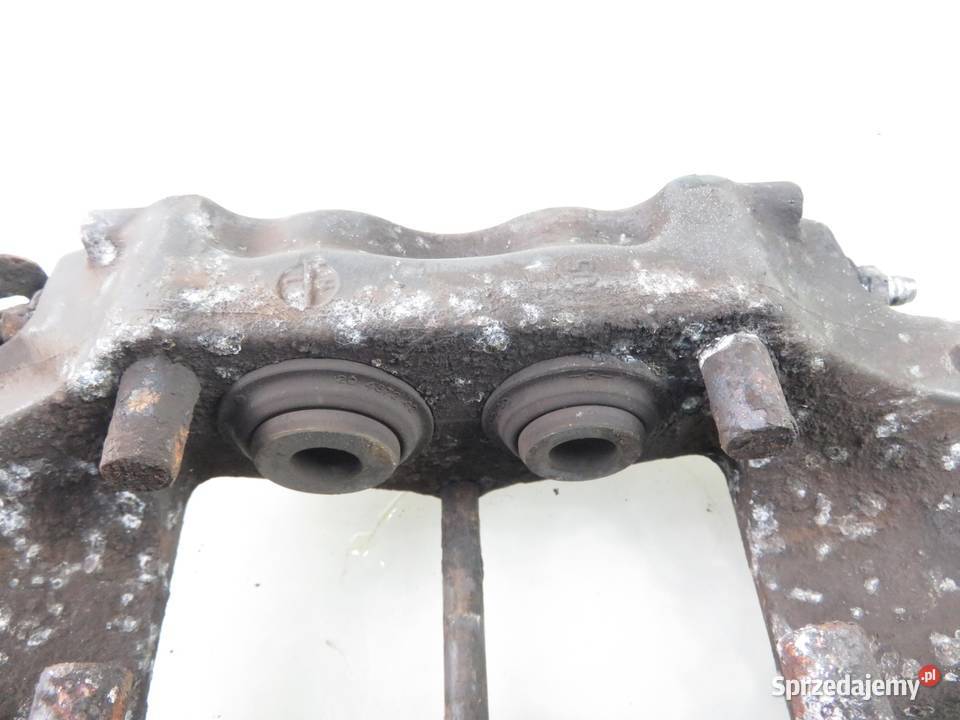 ZACISK LEWY TYŁ AUDI Q7 42 FSI 208930051A Zaciski i jarzma małopolskie