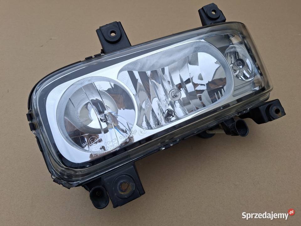MERCEDES ATEGO II 2 REFLEKTOR LEWY ORYGINAŁ Lampy przednie Bieleń