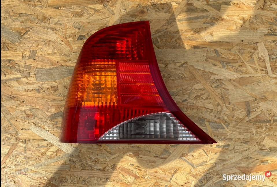 XS4X13405BC LAMPA LEWY TYŁ FORD FOCUS I SEDAN osobowe wielkopolskie Międzychód