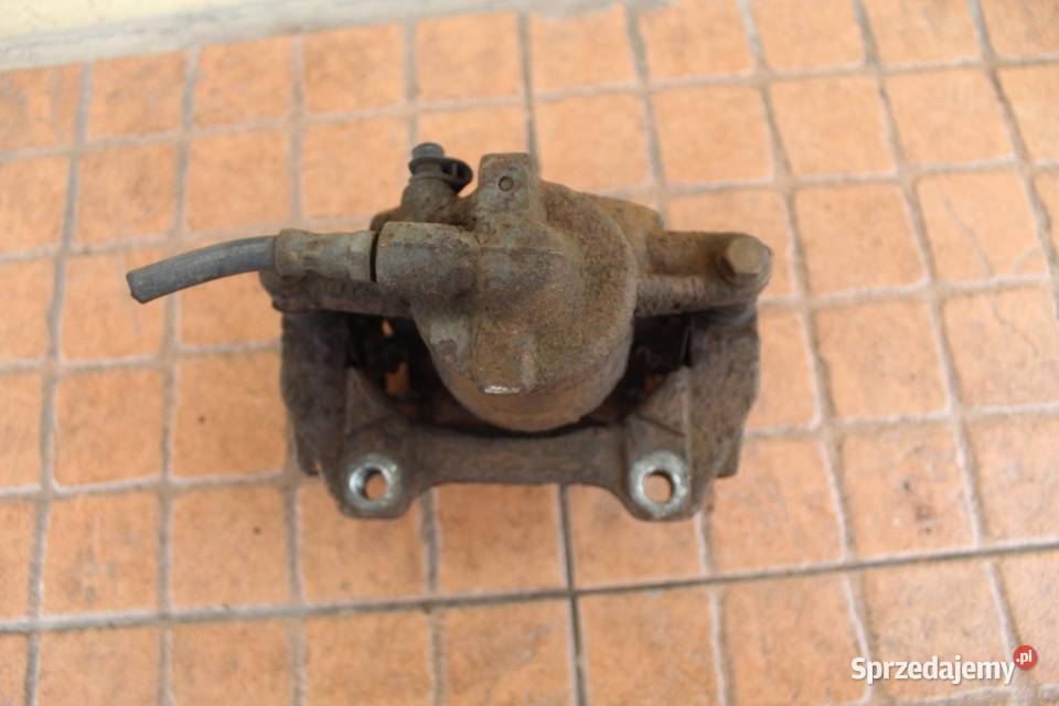 ZACISK HAMULCOWY LEWY PRZÓD OPEL CORSA D 13 CDTI