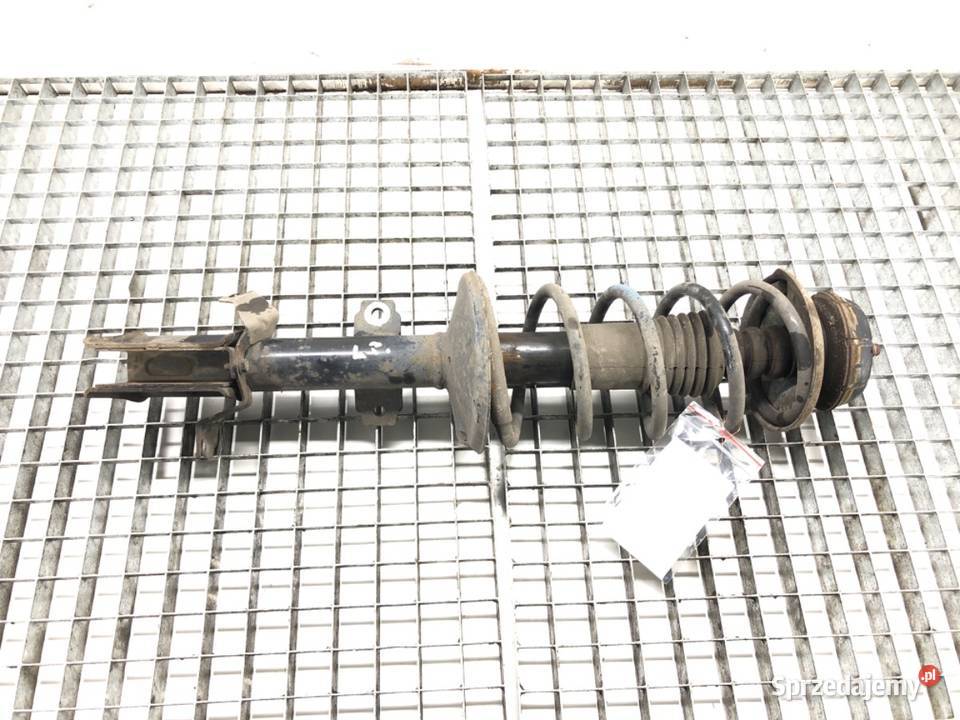 AMORTYZATOR LEWY PRZÓD ZE SPRĘŻYNĄ DACIA DUSTER osobowe podkarpackie