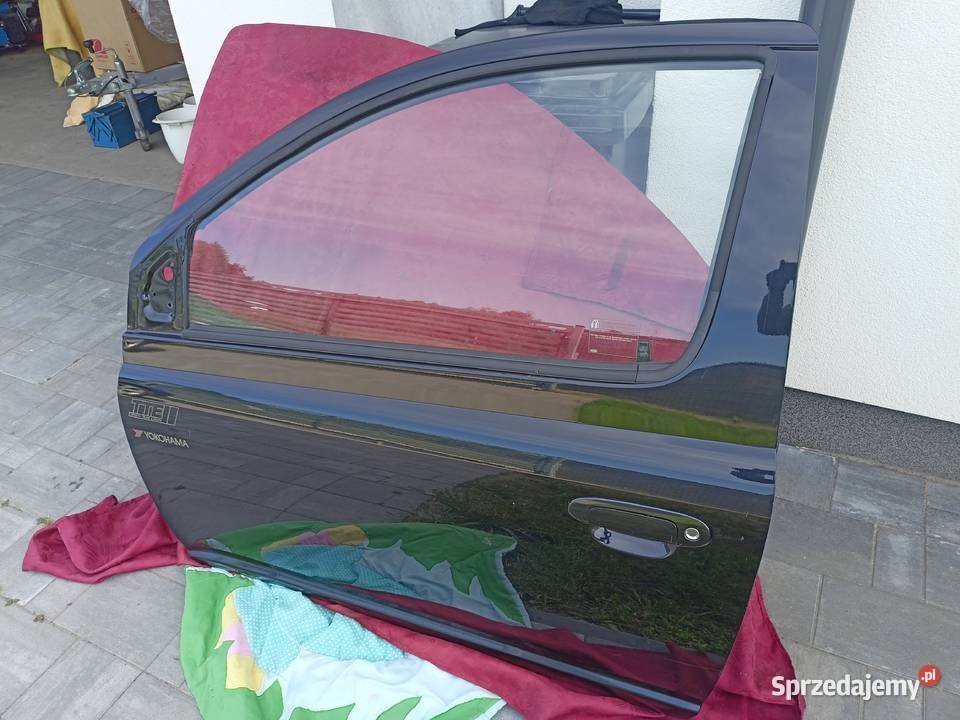 Drzwi prawe lewe Toyota Yaris P1 9905 kod Zalesie Górne