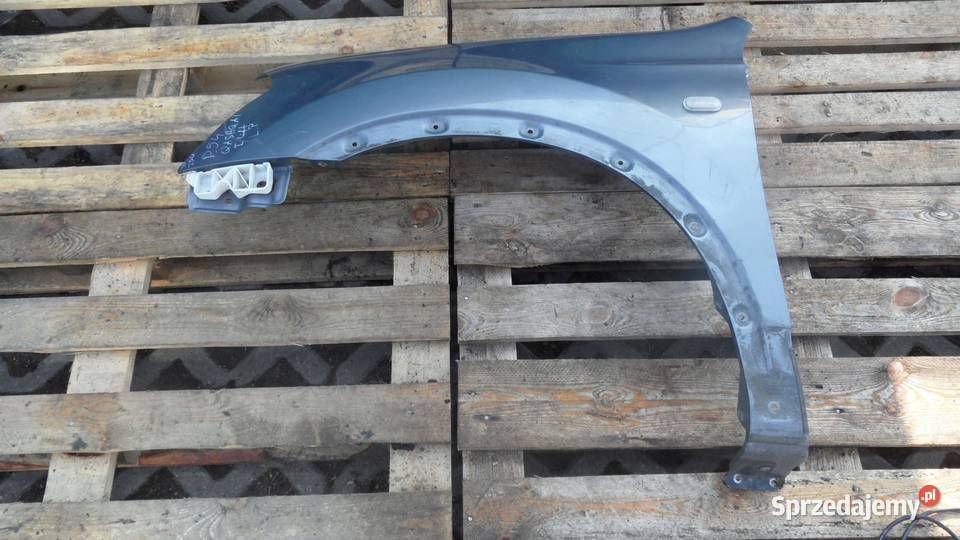 NISSAN QASHQAI I 09r błotnik lewy przód