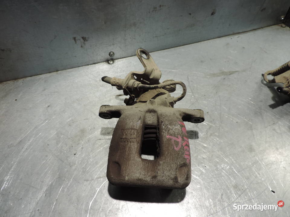 VW TOURAN 19 TDI ZACISK HAMULCOWY PRAWY TYŁ osobowe Nowy Sącz