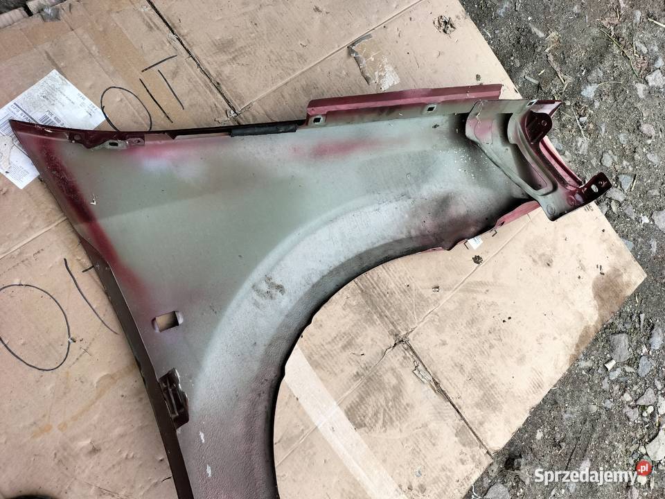 DACIA LOGAN I BŁOTNIK LEWY PRZÓD