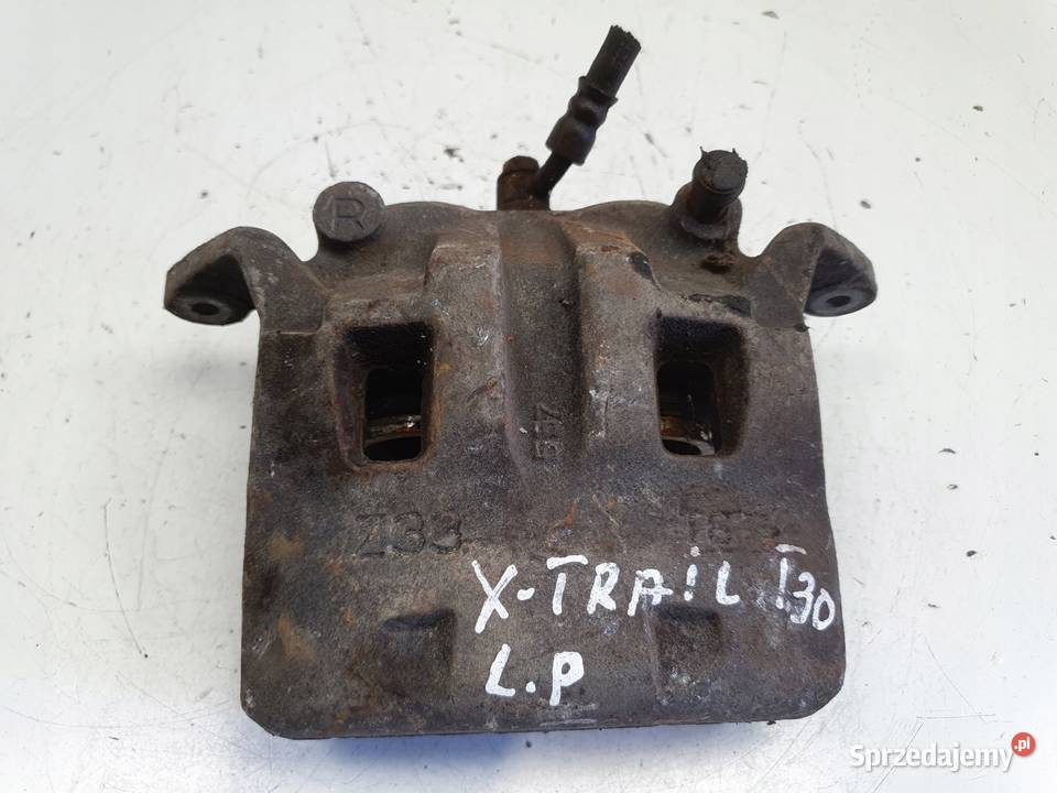 Nissan XTrail T30 PRZEDNI ZACISK HAMULCOWY lewy Rudka