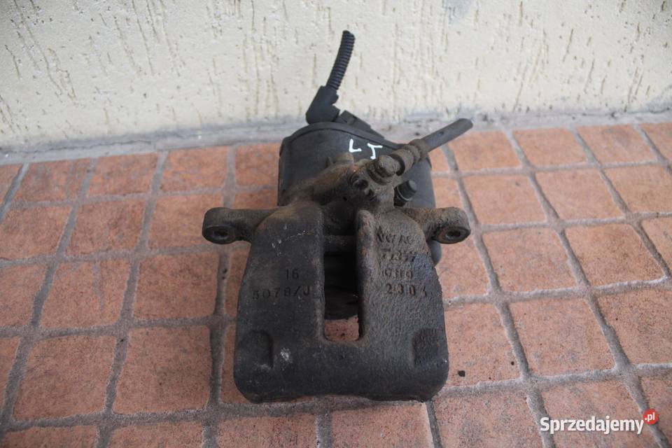 ZACISK HAMULCOWY LEWY TYŁ VW PASSAT B6 20 TDI