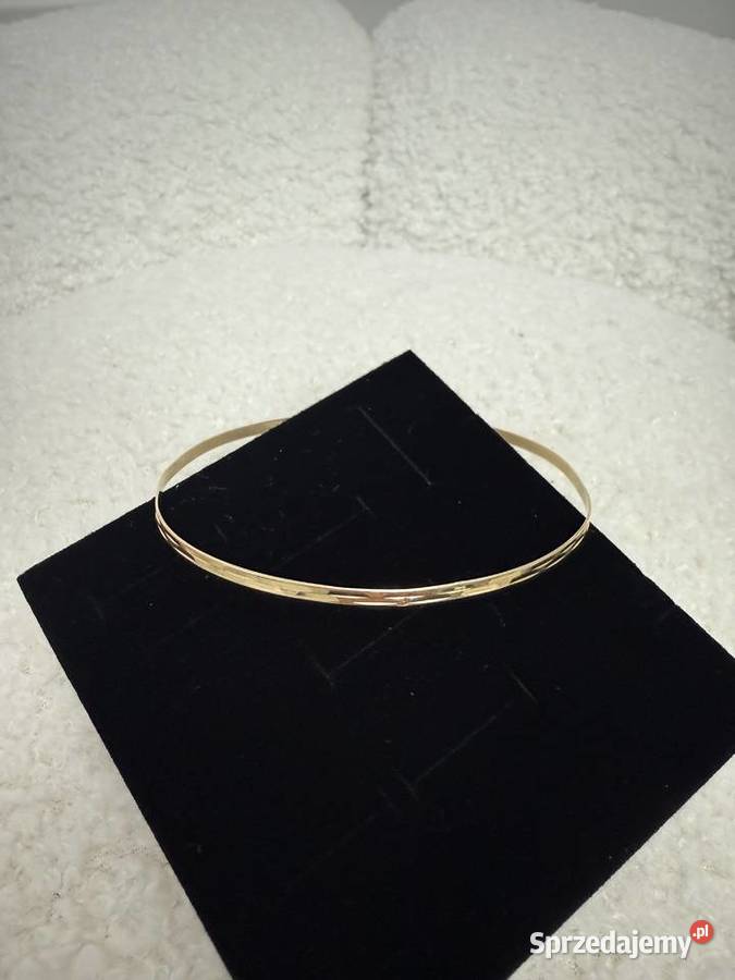 Złota bransoletka koło Bażyny