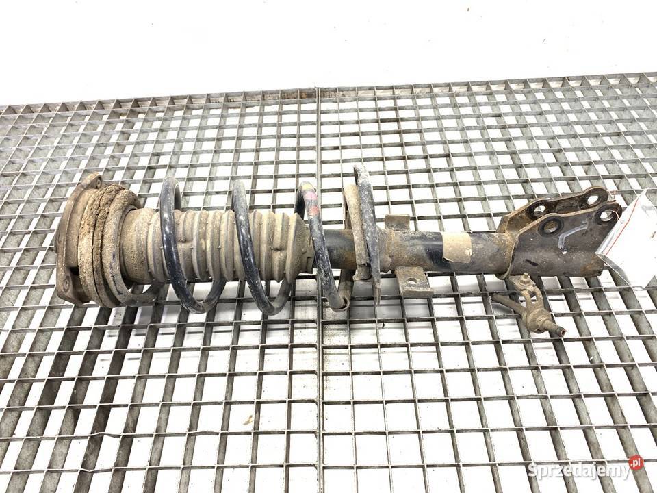 AMORTYZATOR LEWY PRZÓD ZE SPRĘŻYNĄ RENAULT osobowe