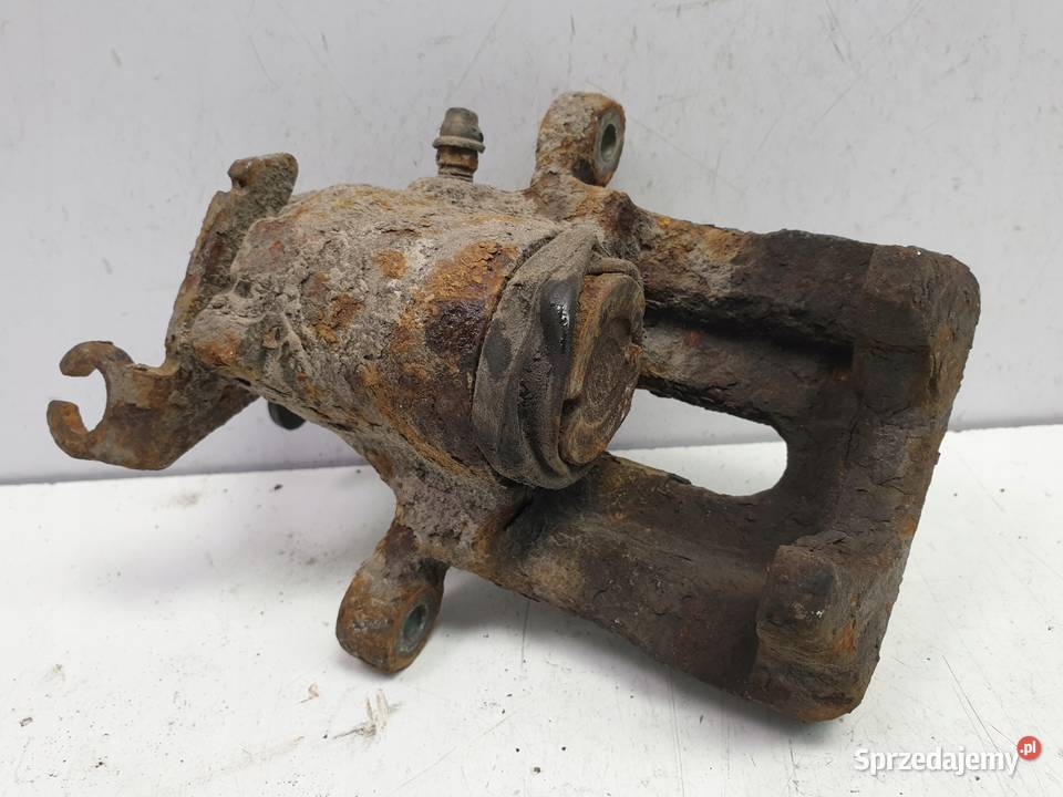 Volvo S40 V40 ZACISK HAMULCOWY Lewy tył kierowcy Rudka