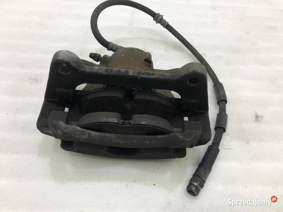 ZACISK LEWY PRZÓD VOLKSWAGEN TOURAN III