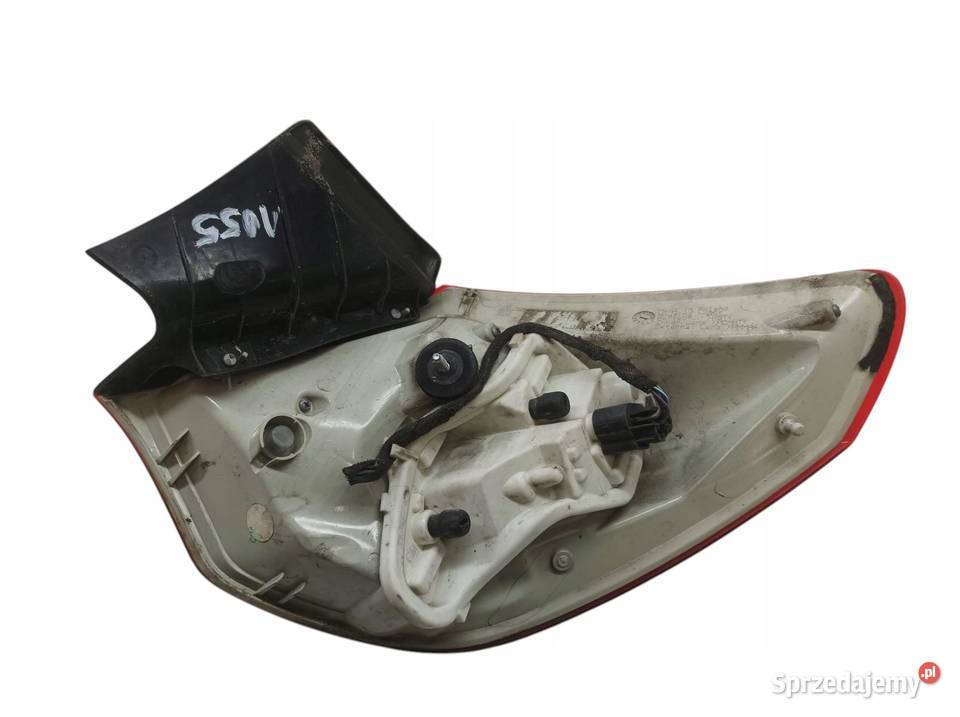 LAMPA TYŁ LEWY TYŁ W BŁOTNIK HB 5D Opel Astra IV