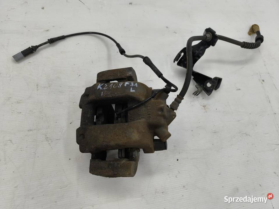 ZACISK LEWY PRZÓD BMW F31 20D LIFT osobowe