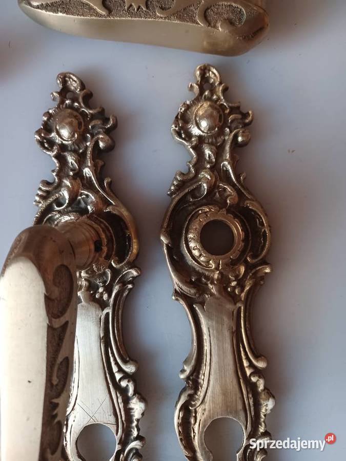 Komplet klamek i szyldów Mosiądz Poznań sprzedam