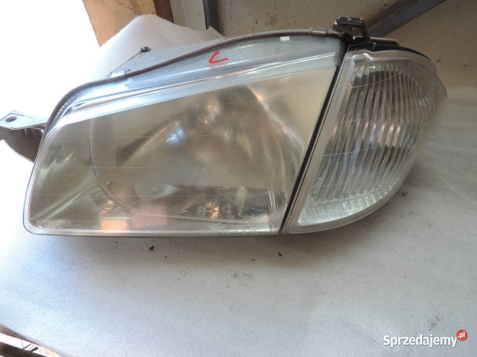 REFLEKTOR LEWY LAMPA KIERUNEK MAZDA 323 F Oświetlenie Nowy Sącz sprzedam