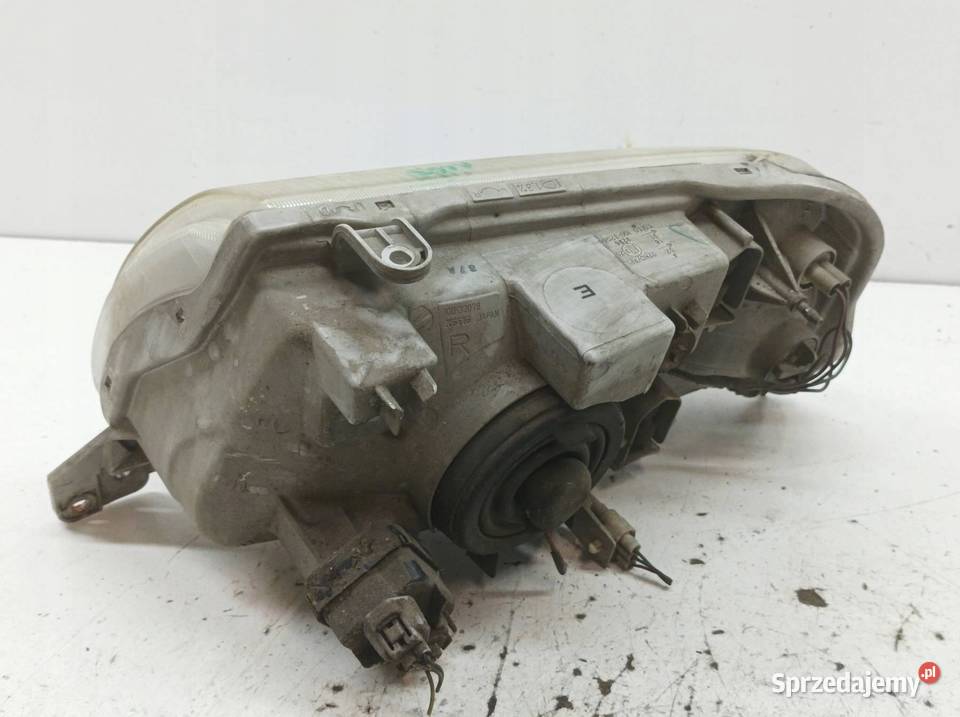 LAMPA PRZÓD PRAWA EU 10032080 Suzuki Grand Lampy przednie