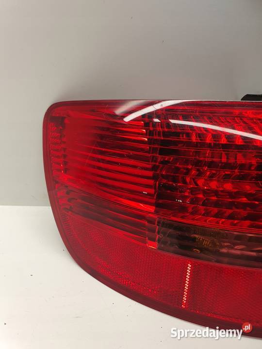 LAMPA LEWY TYŁ W BŁOTNIK AUDI A6 C6 4F9945095 Przystajń