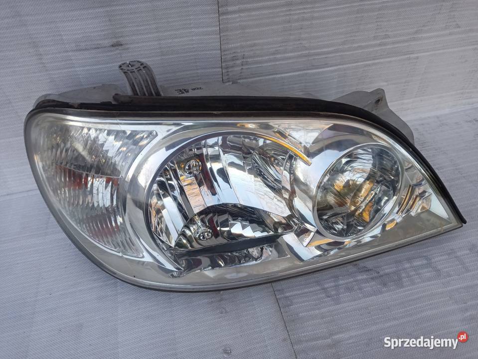 Kia Carnival 1 I lampa przednia prawa reflektor Sieradz