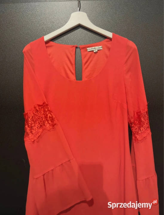 Elegancka różowa sukienka z koronkowymi rękawami Bez wzoru Spódnice i sukienki Łódź