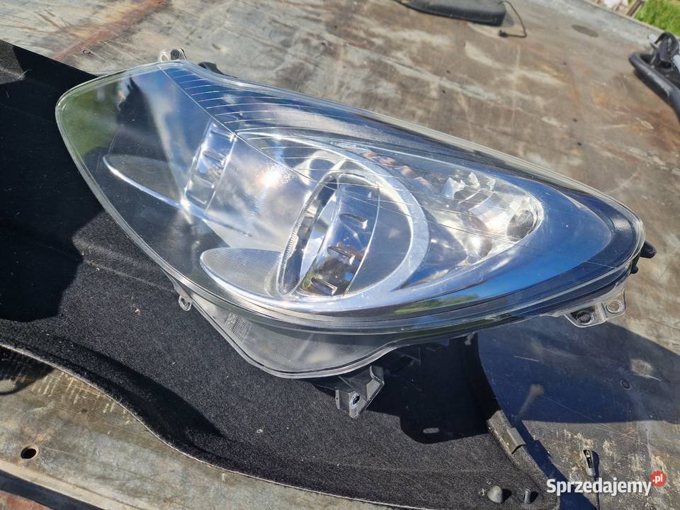Opel Corsa D reflektor ORG EU podkarpackie Mielec