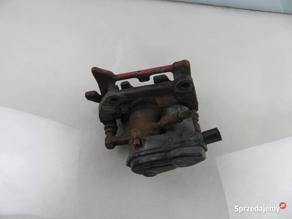 ZACISK LEWY TYŁ AUDI A4 B8 20 TDI 32335478 osobowe małopolskie