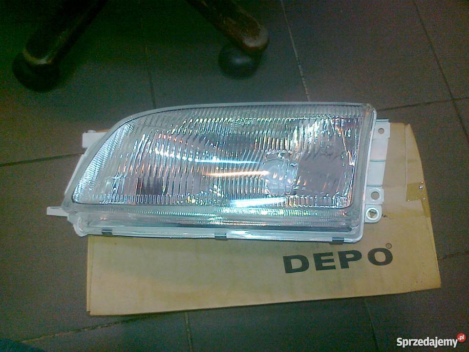 TOYOTA CARINA E 9295 REFLEKTOR H4 NOWY DEPO LE Pruszków sprzedam
