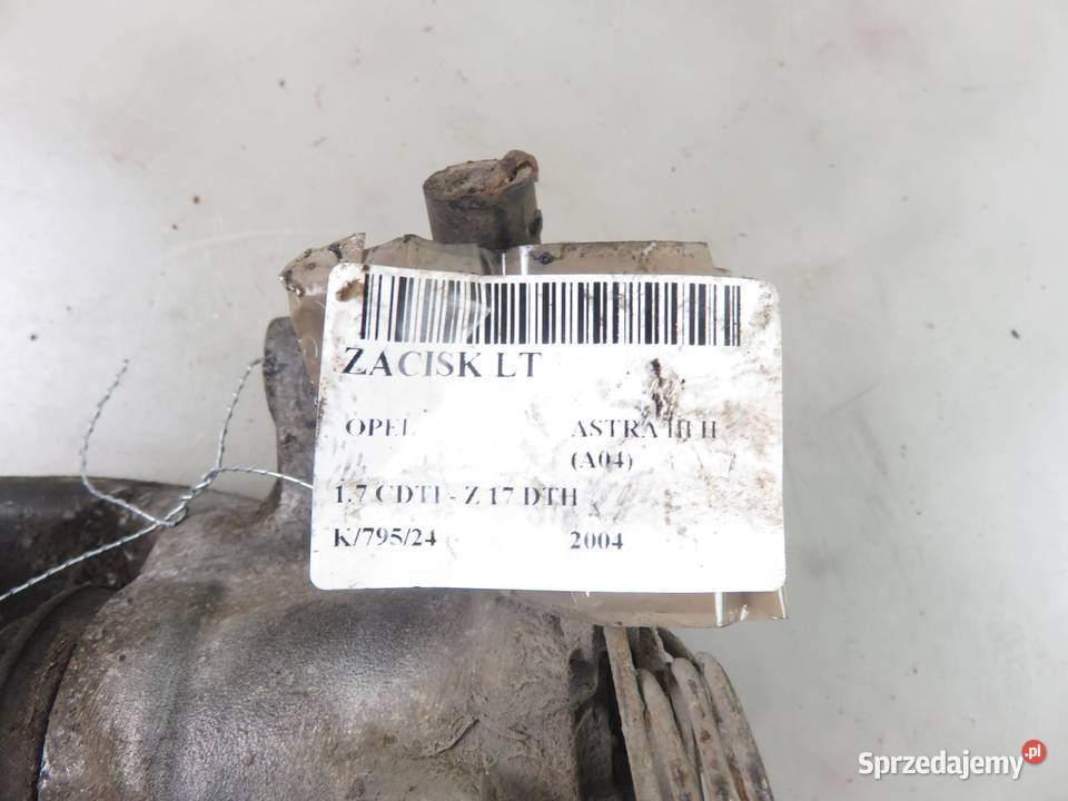 ZACISK LEWY TYŁ OPEL ASTRA III H 17 CDTI osobowe Motoryzacja