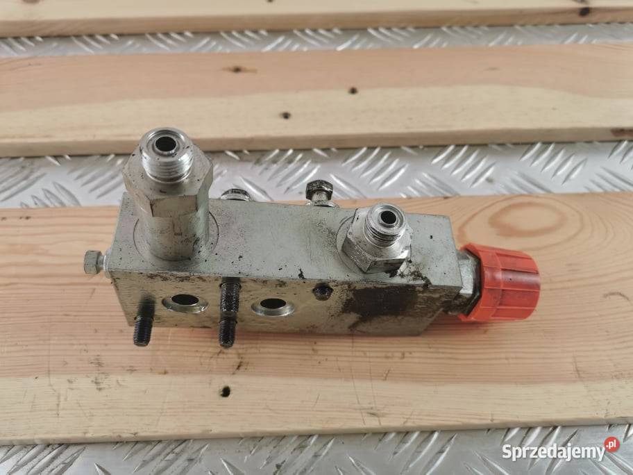Holland LM 5080 Zamek cylindra wysypu Wilkowo sprzedam