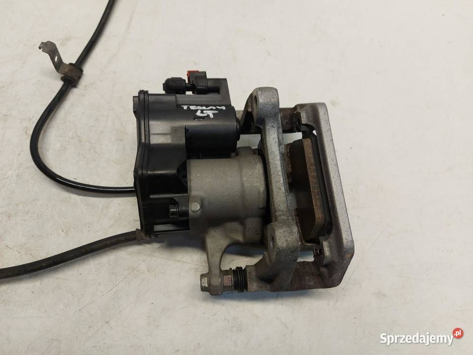 TESLA MODEL Y 2023r Zacisk hamulcowy tył lewy