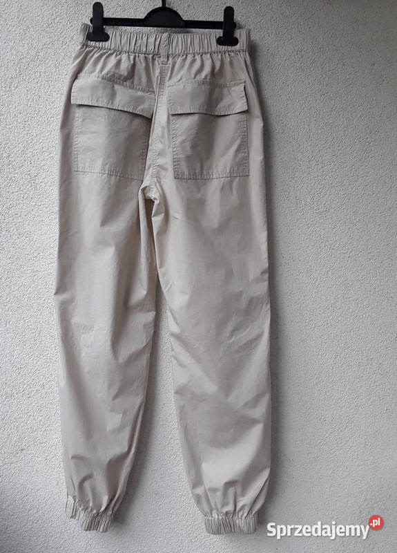 Kremowe spodnie parchute baggy Cropp r32 Warszawa