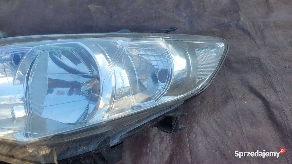 TOYOTA COROLLA E15 LAMPA REFLEKTOR LEWY PRZÓD osobowe Ruda Śląska sprzedam