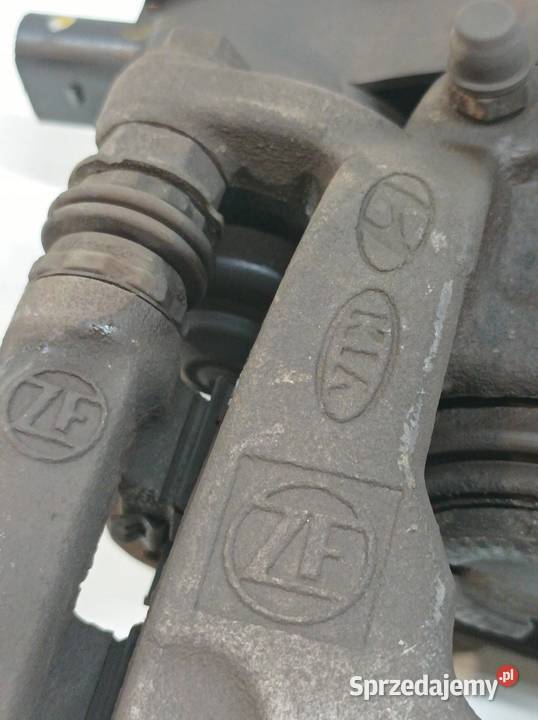 ZACISK HAMULCOWY LEWY TYŁ ELEKTRYCZNY 58210N7600